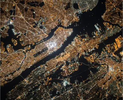 Aerial of manhattan at night with city lights