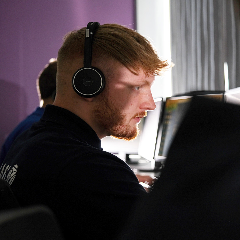 MASS staff member at their desk